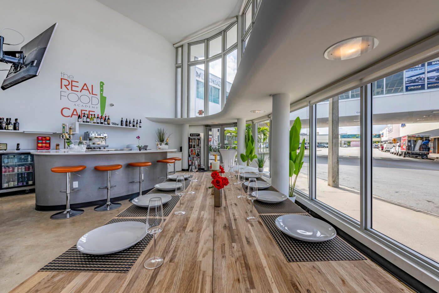 A wide shot of The Real Food Academy food tables and bar.