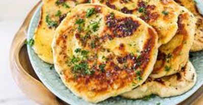 The Real Food Academy Miami fresh garlic naan bread.
