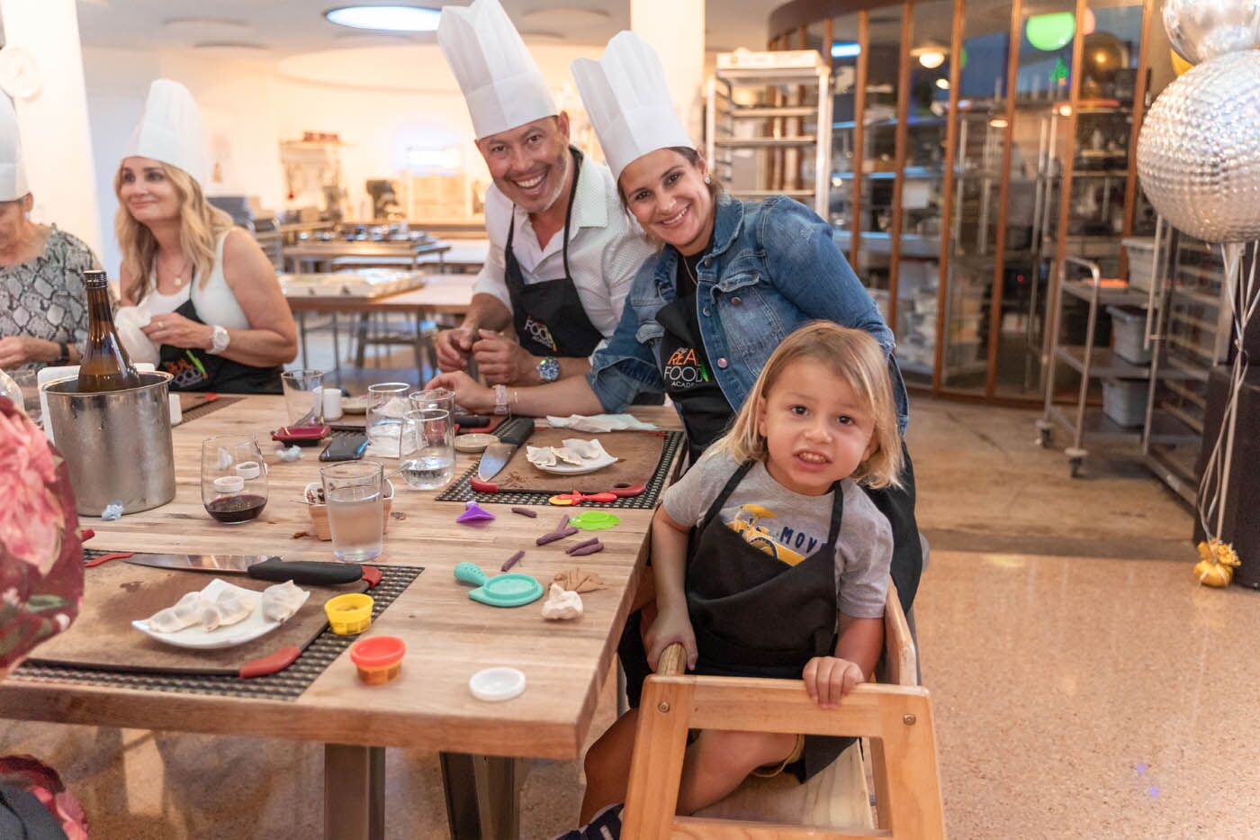 A group cooking at The Real Food Academy adult party.