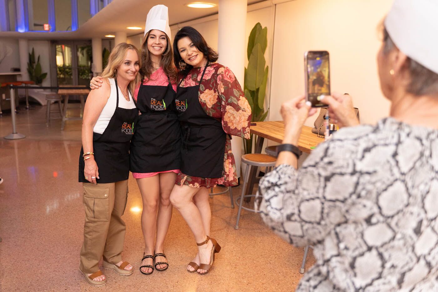 A man dancing with a fresh plate of food at The Real Food Academy's adult cooking class.