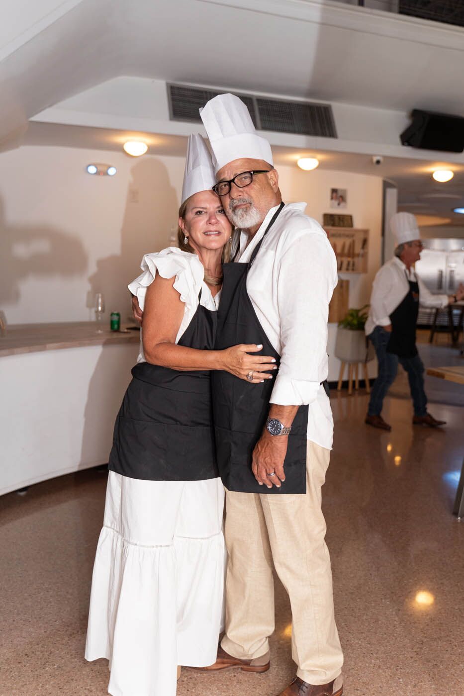 An older couple dancing at one of The Real Food Academys date night cooking classes.