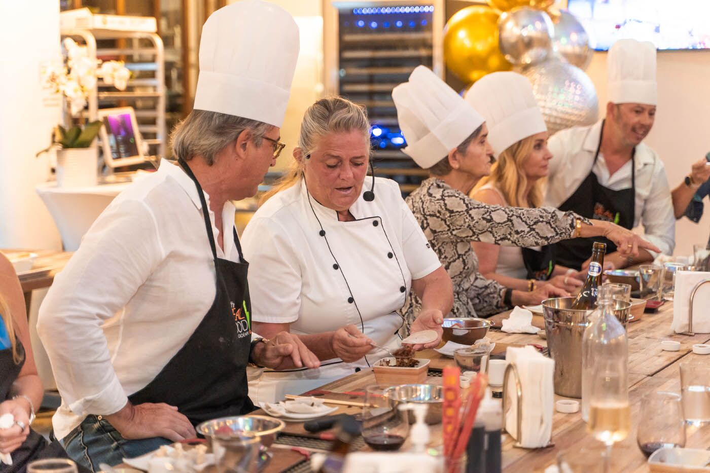 A The Real Food Academy chef teaching a corporate team at our corporate party venue.