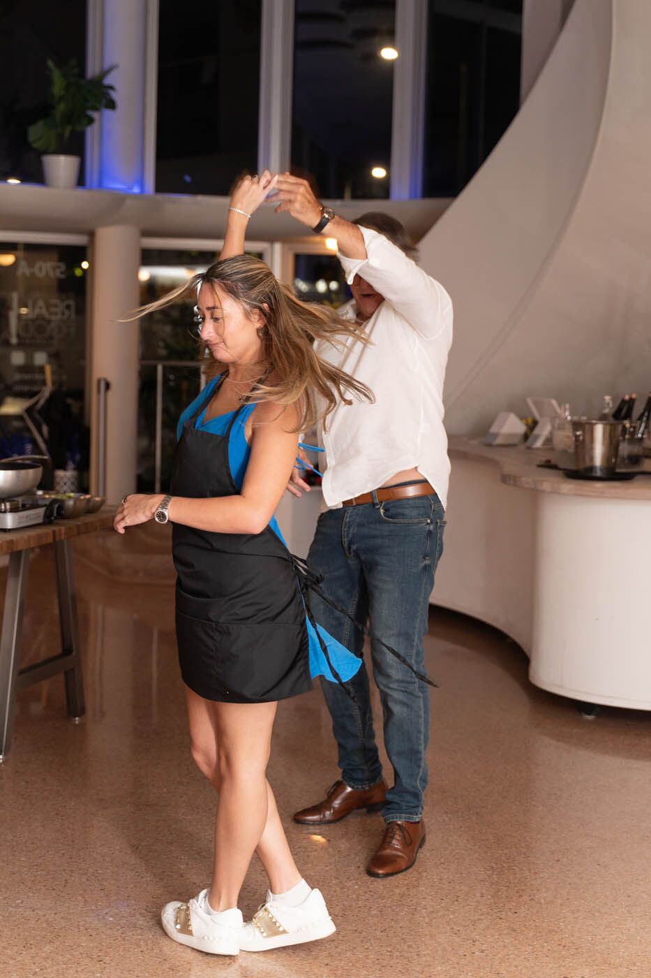 A corporate team cooking fresh pot stickers at our corporate party venue.