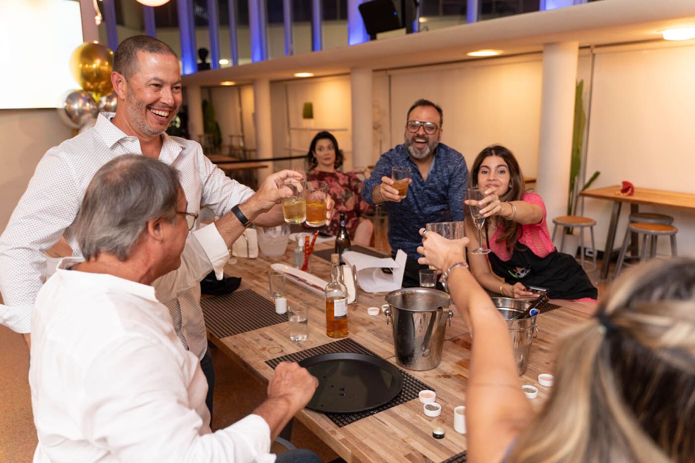 A group of adult drinking at The Real Food Academy's adult birthday party venue.