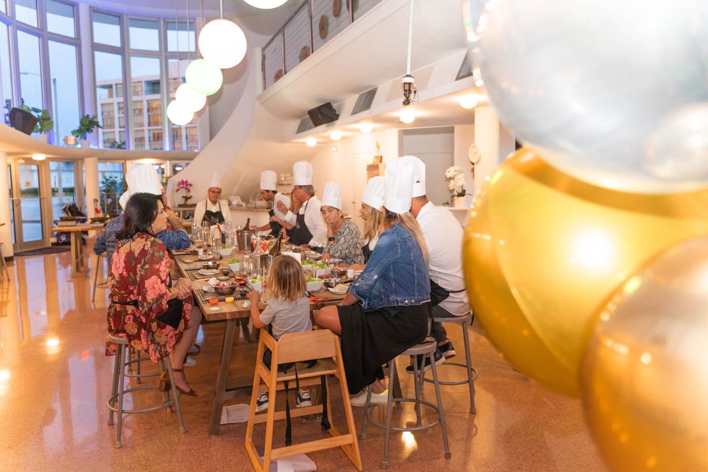 A family at The Real Food Academy's cooking party, we are one of the top birthday party places. 