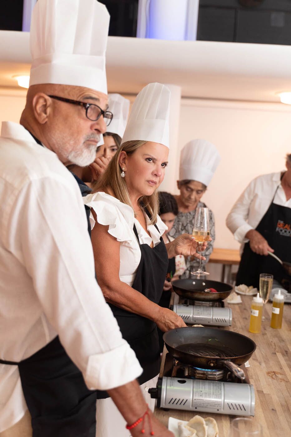 A group of adults at a adult-only The Real Food Academy Valentine's cooking class.