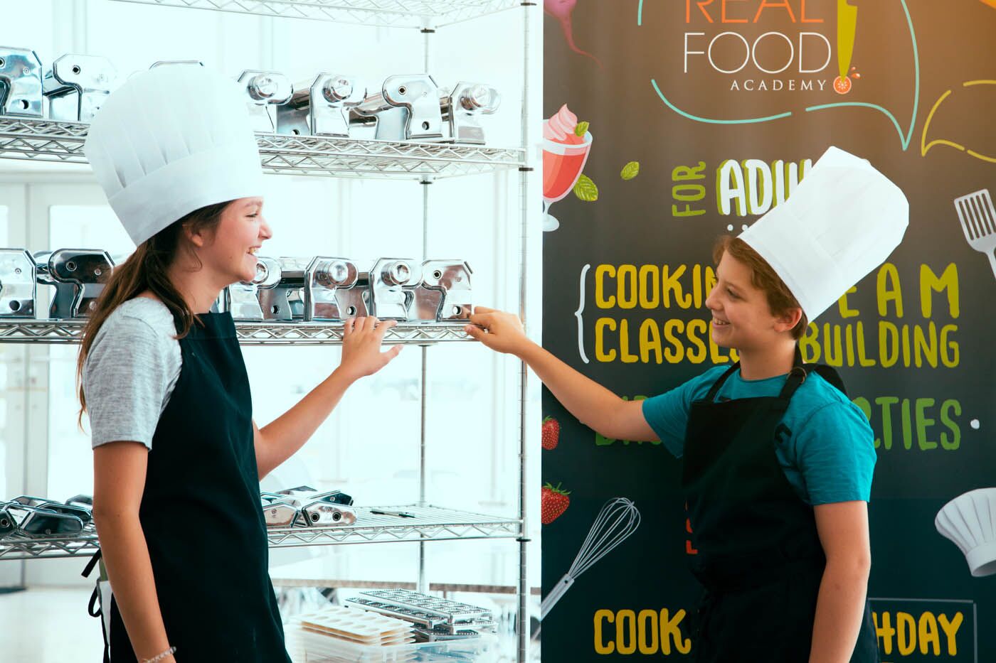 Two kids chatting at The Real Food Academy's spring break camp. 
