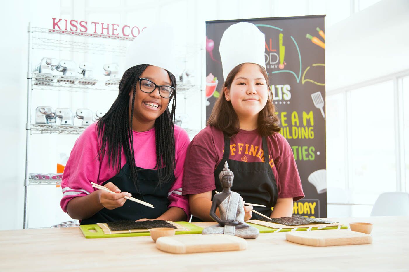 Two young girls at The Real Food Academy's cooking class for teens. 