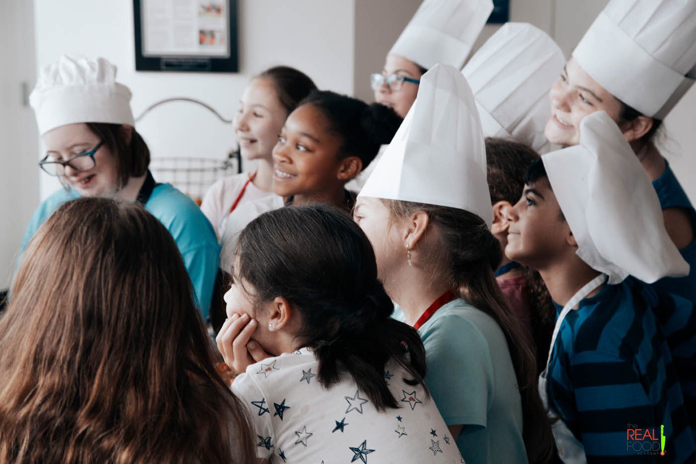 A group of eager young chefs as a The Real Food Academy cooking camp.