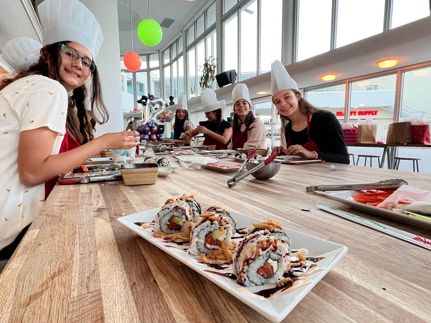 Long table view of a kids party at The Real Food Academy.