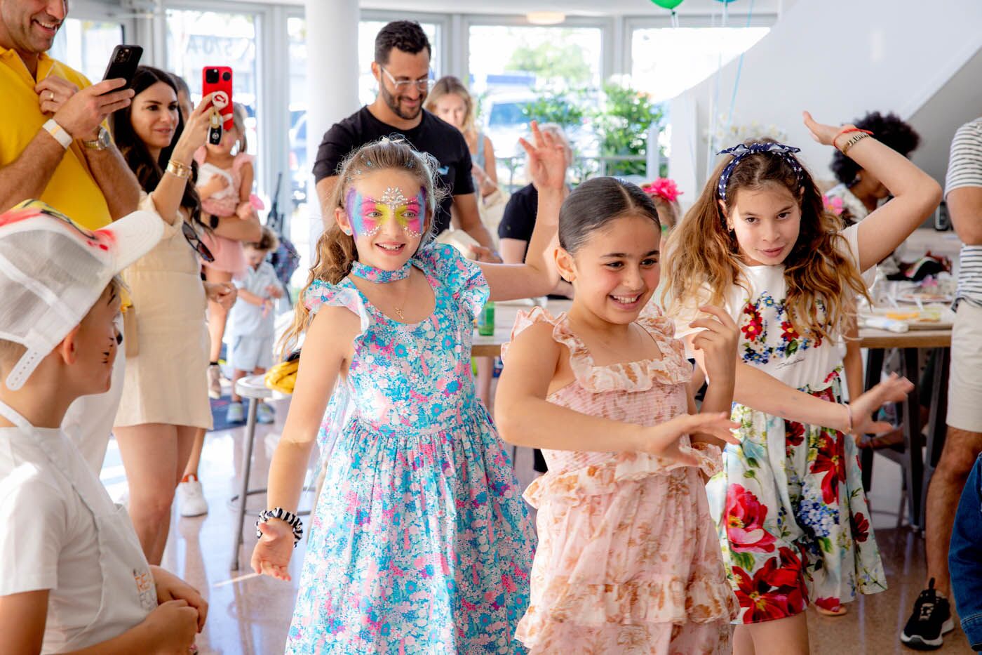Little girls wearing butterfly masks at The Real Food Academy's kids birthday pary place.