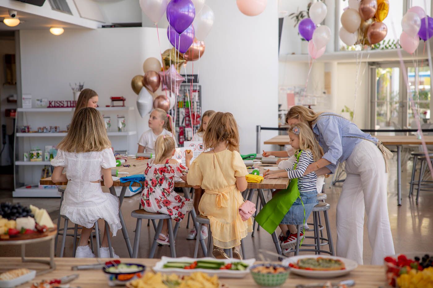 A picture of The Real Food Academy's kids birthday party place, an indoor venue with tall windows.