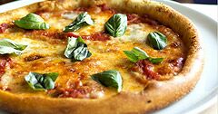 The Real Food Academy Miami fresh made dish pizza with basil.