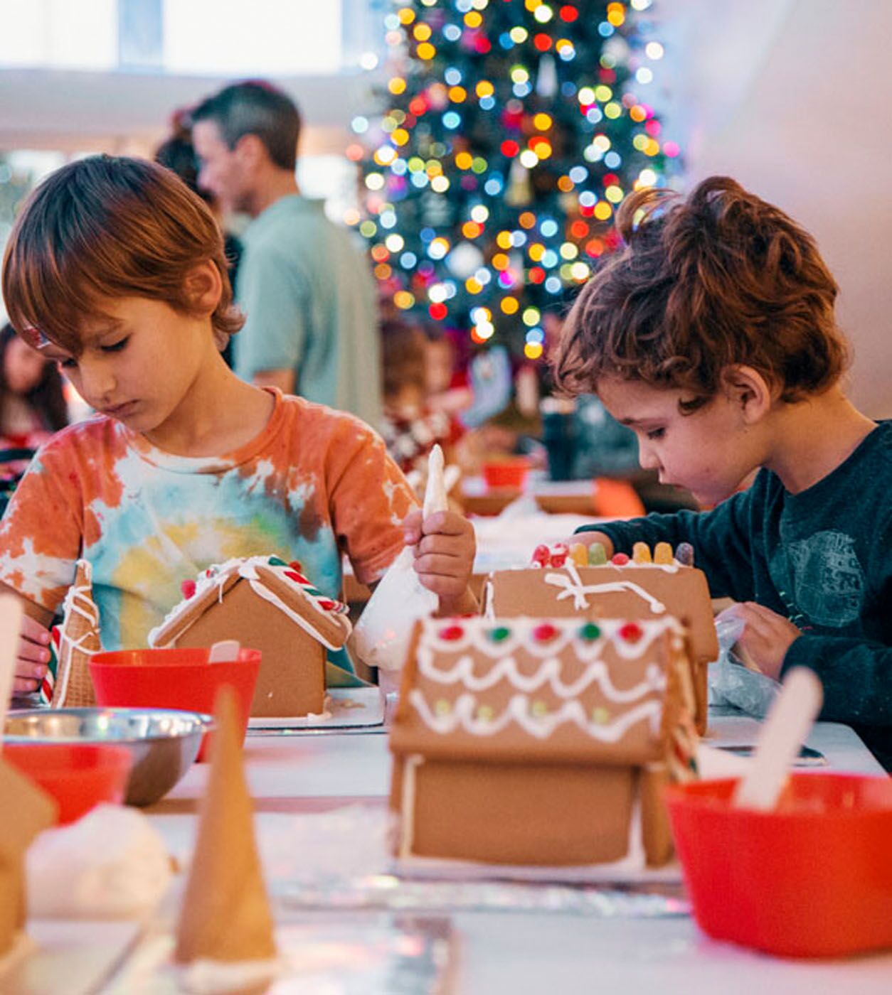 A group of kids creating magic at our gingerbread house cooking classes!