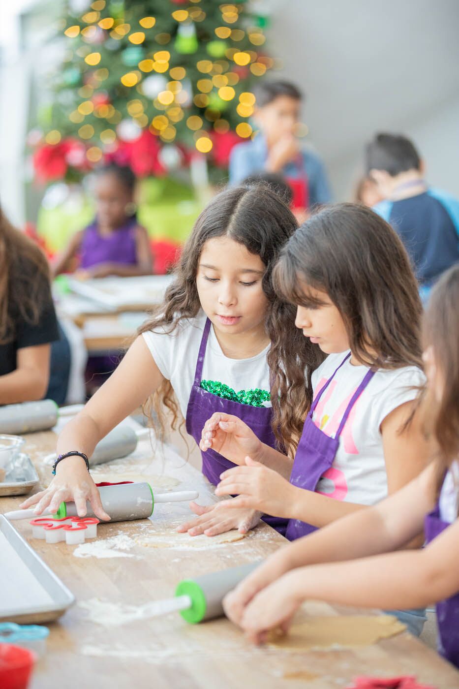 Kids cooking at a christmas themed holiday cooking class at The Real Food Academy.