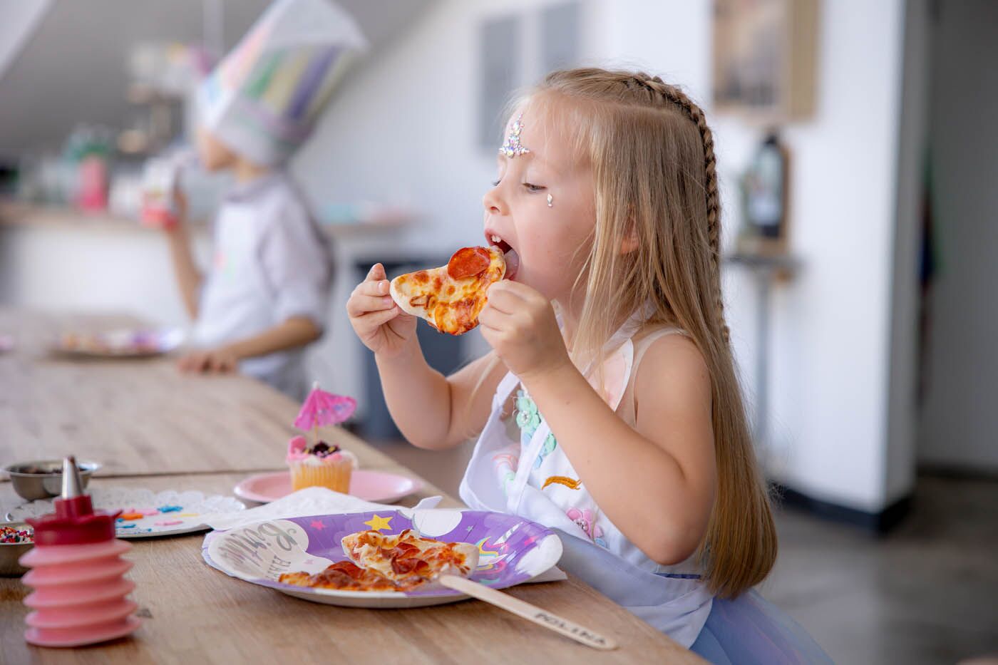 Little girl having fun at The Real Food Academy kids party.