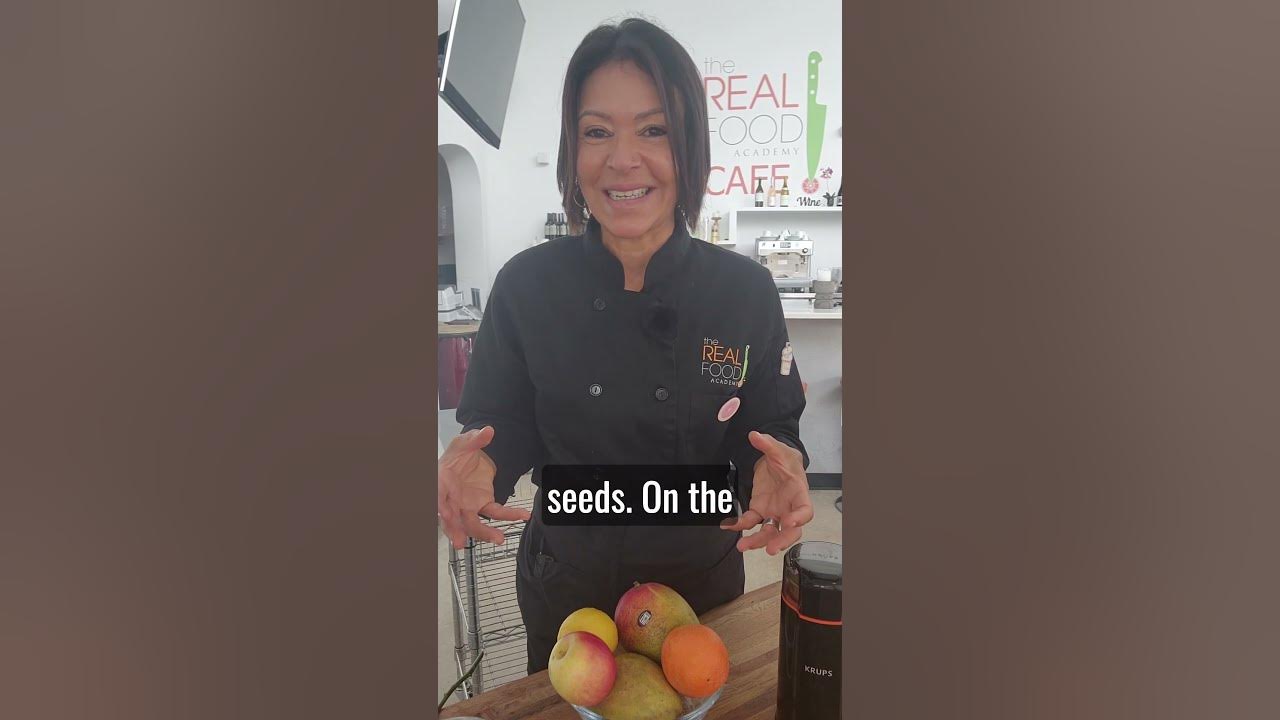 The Real Food Academy Head Chef Maria teaching a trip to mumbai recipe.