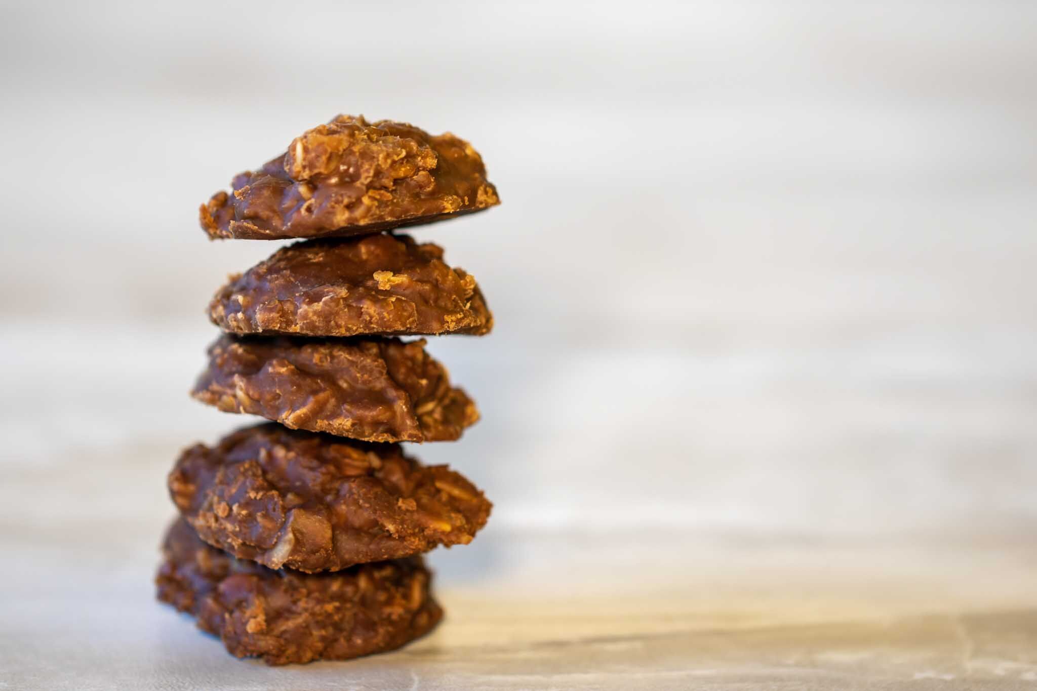 Mix nuts and fruit for a healthy no bake cookie at The Real Food Academy Miami.