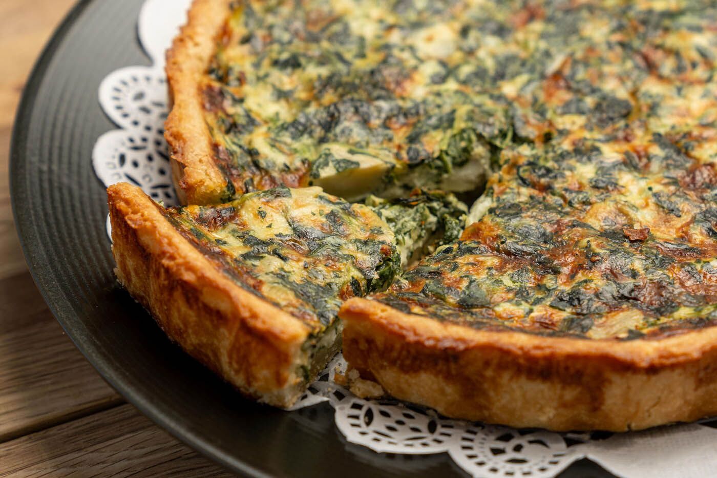 Quiche on a white plate at The Real Food Academy.