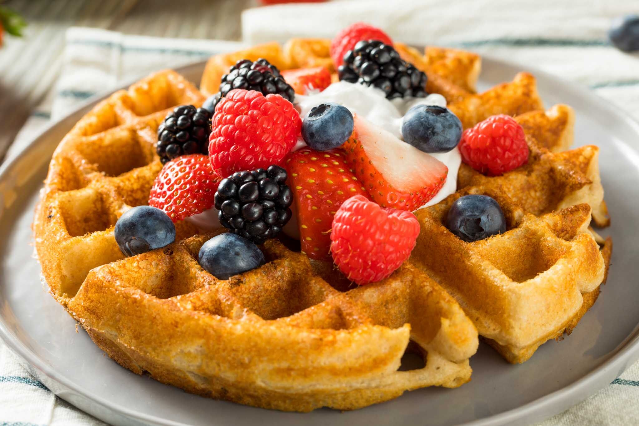 Fresh waffles with organic fruit at The Real Food Academy Miami.